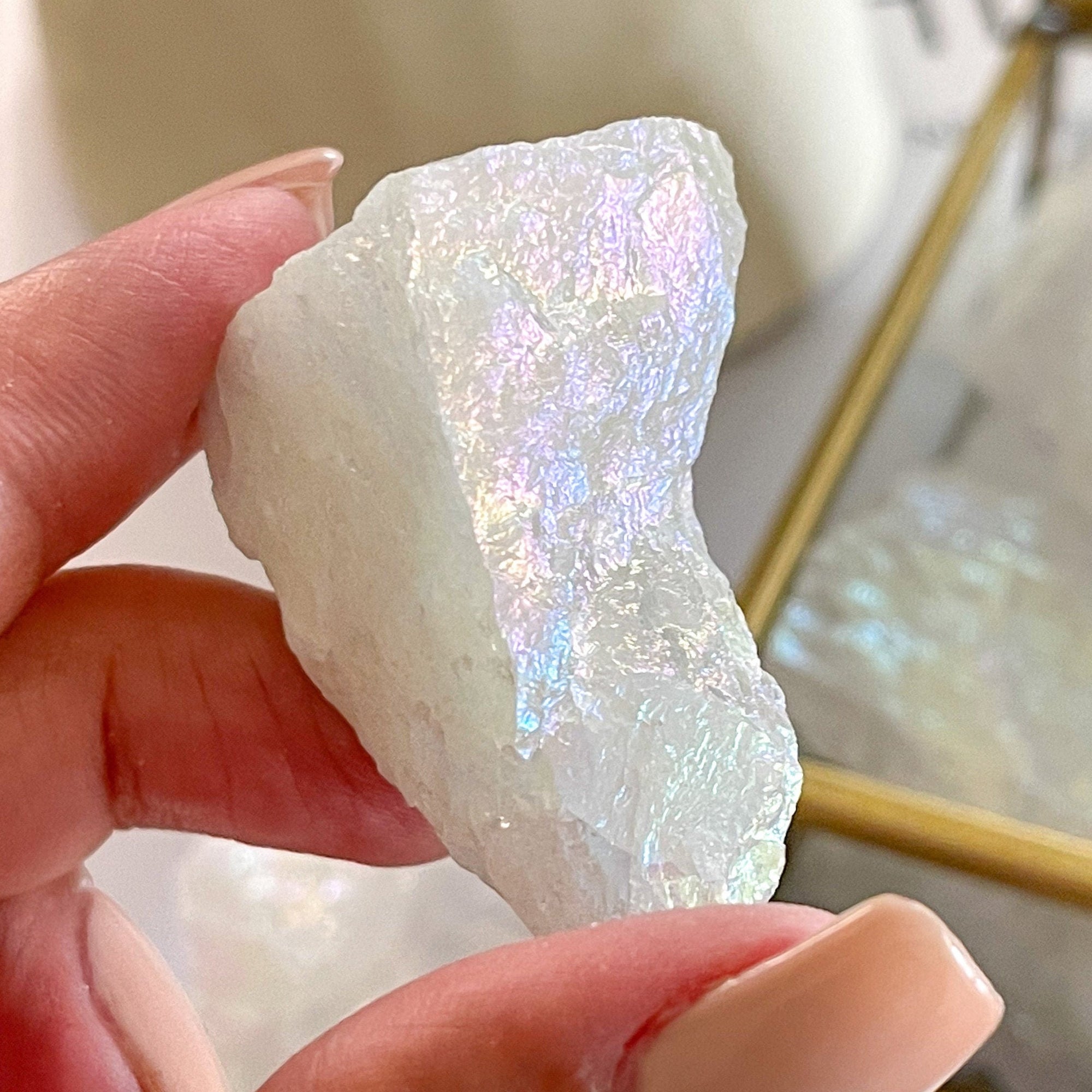 Rainbow Magic: Unleashing the Healing Properties of the Angel Aura Quartz Crystal