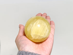Radiant Lemon Calcite Sphere: Healing Crystal Home Decor