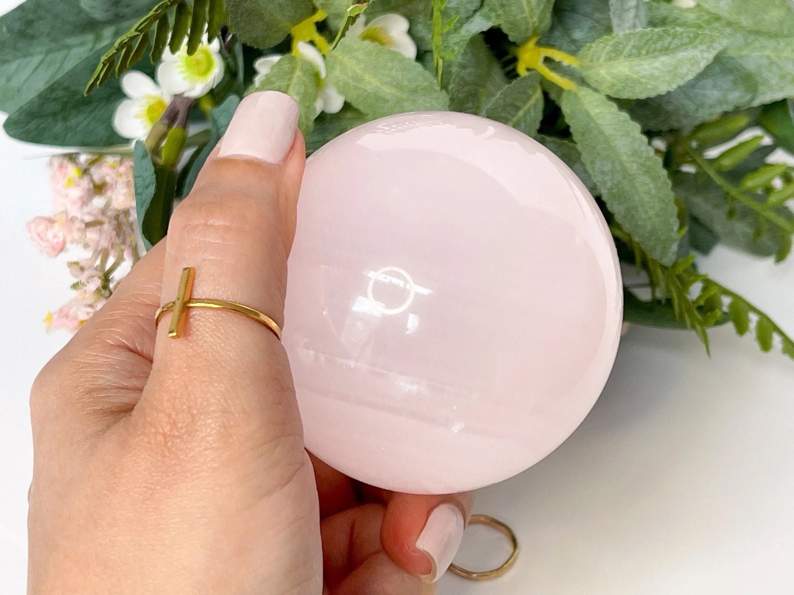 Mangano Calcite Crystal Sphere : A UV-Reactive Pink Crystal for Healing and Harmony