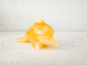 Hand Carved Orange Calcite Dolphin Figurine: Healing Crystal Decor (3")
