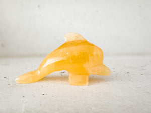 Hand Carved Orange Calcite Dolphin Figurine: Healing Crystal Decor (3")
