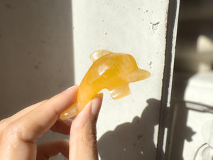 Hand Carved Orange Calcite Dolphin Figurine: Healing Crystal Decor (3")