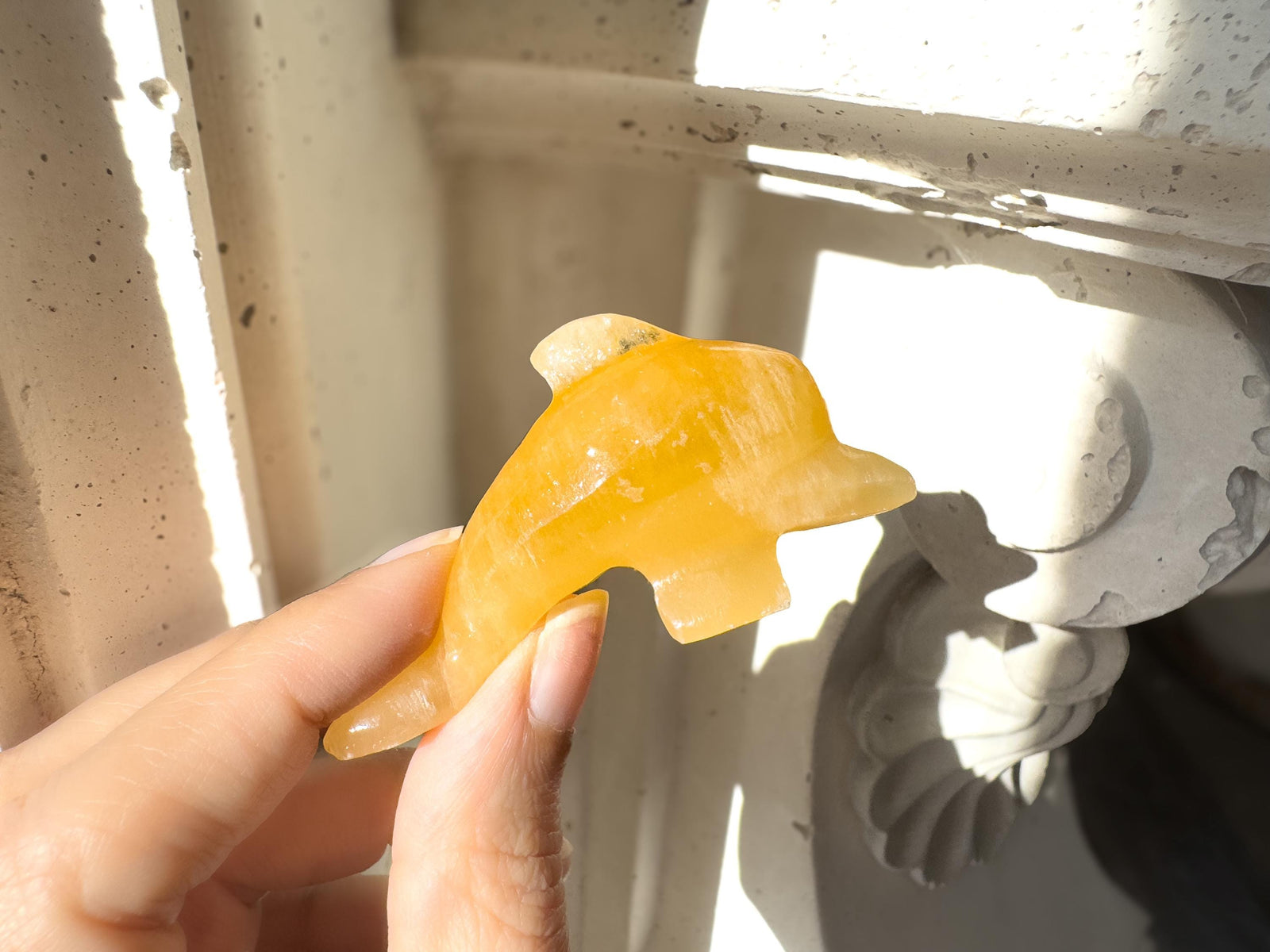 Hand Carved Orange Calcite Dolphin Figurine: Healing Crystal Decor (3")