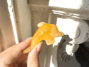 Hand Carved Orange Calcite Dolphin Figurine: Healing Crystal Decor (3")